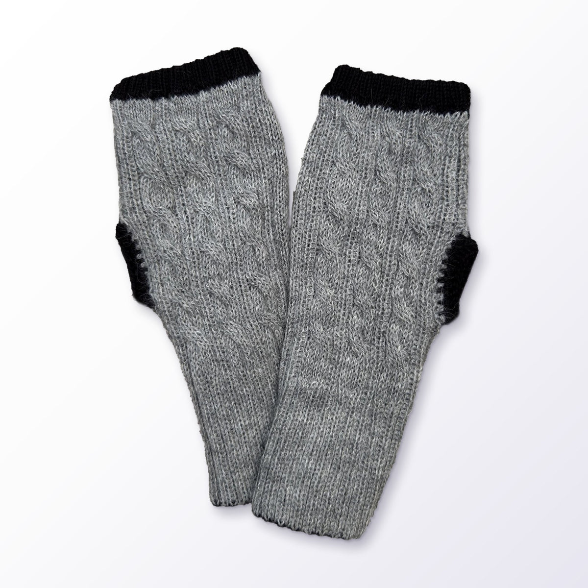 Grey & Black Reversible Cable Knit Baby Alpaca Fingerless Gloves on a plain white background